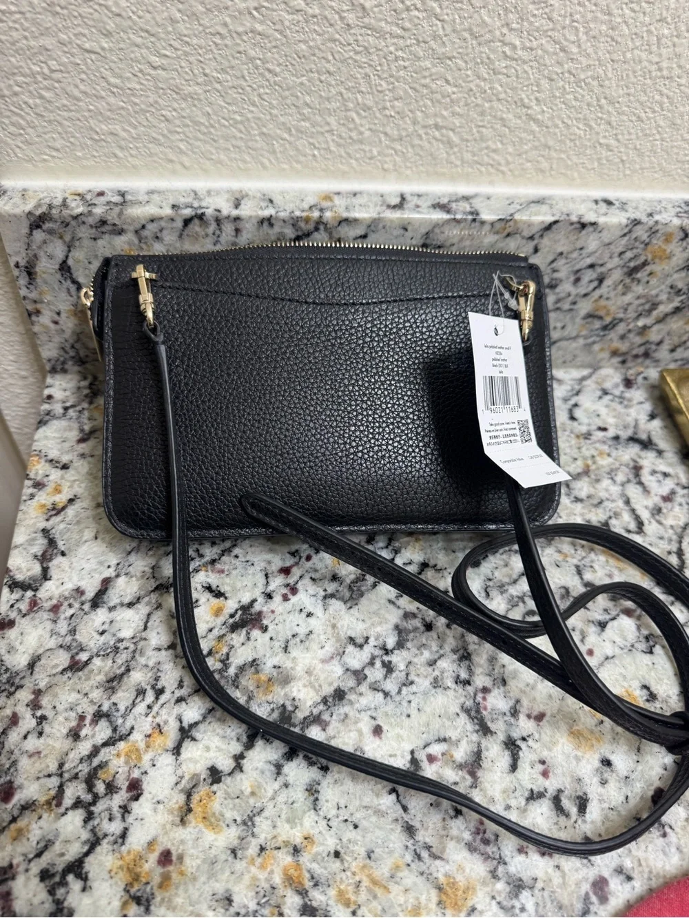kate spade black pebbled leather crossbody with gold logo
